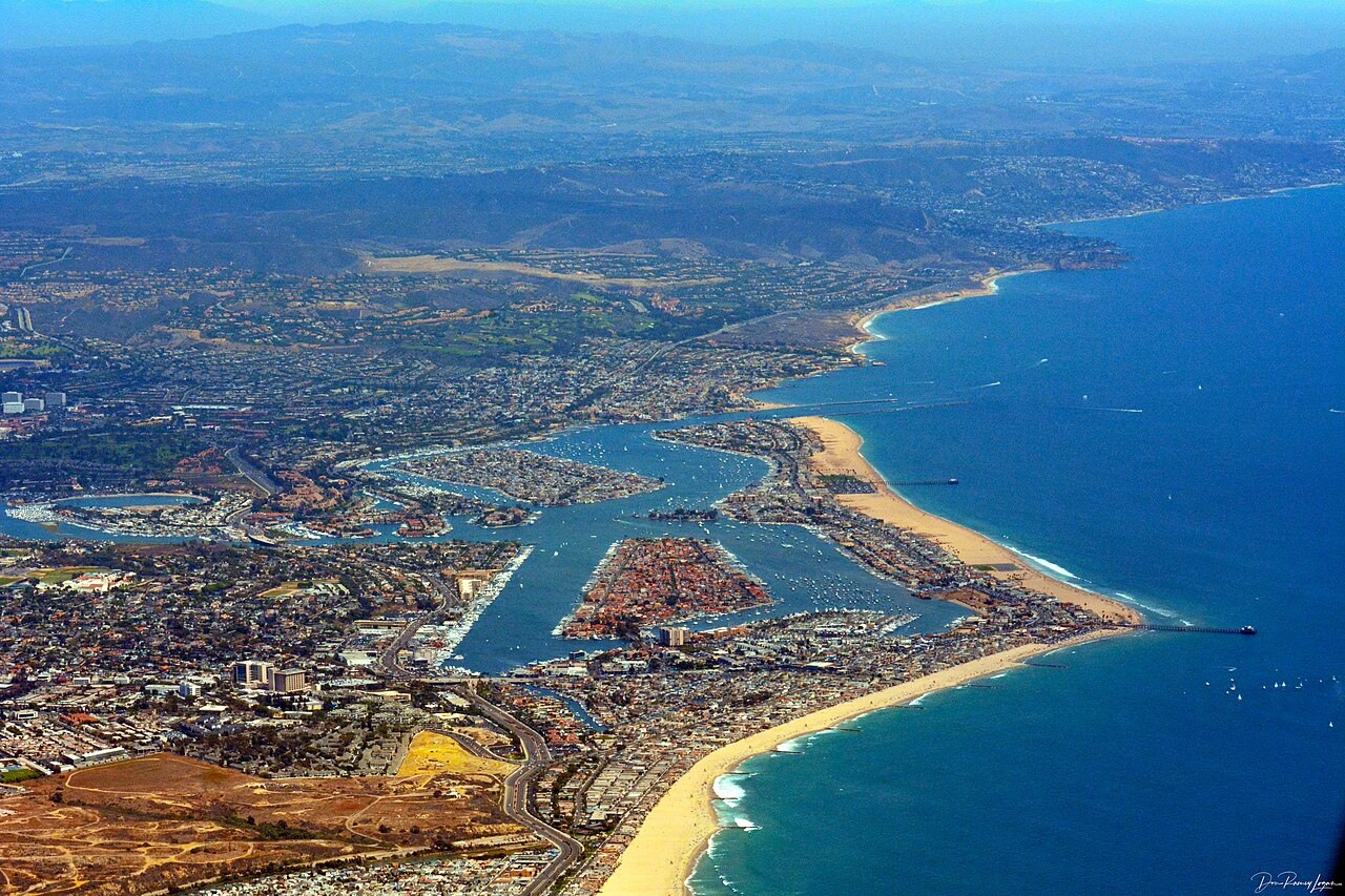 An aerial view of Newport Beach, its harbor, and the Balboa Peninsula.